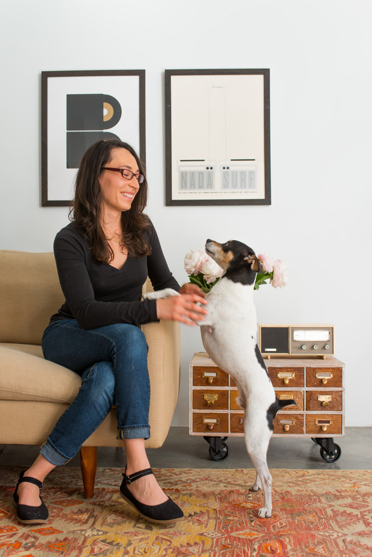 Woman in modern interior with dog